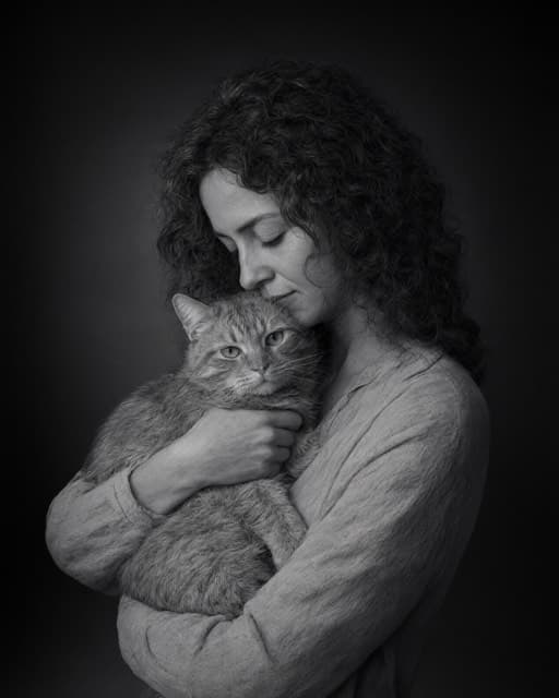 Sample portrait of a person and their cat: Black & white, held close